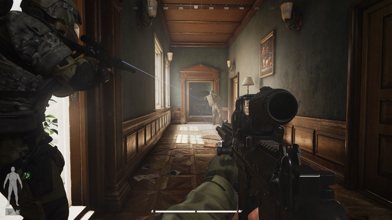 Clearing a mansion hallway: note the on-screen HUD — the compass up top and the body-part health silhouette in the bottom-left corner that tracks limb damage.